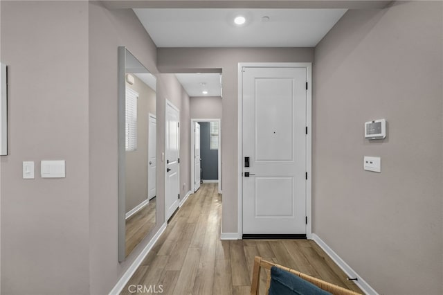 hallway with light wood-type flooring