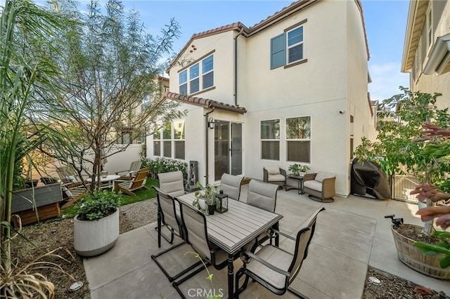 rear view of house with a patio