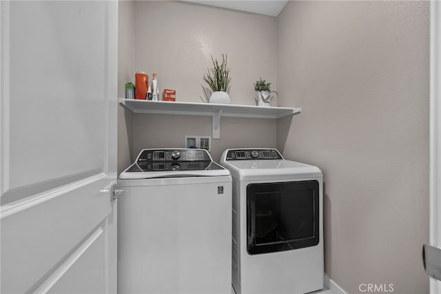 laundry room featuring separate washer and dryer