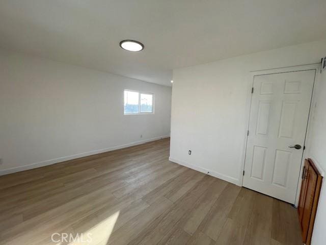 unfurnished room featuring light hardwood / wood-style flooring