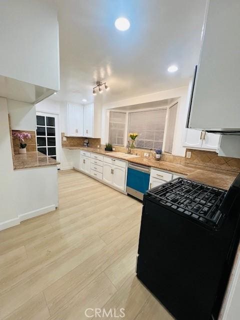 kitchen with dishwasher, sink, black range with gas stovetop, white cabinets, and light hardwood / wood-style floors