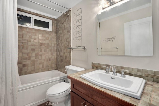 full bathroom with toilet, vanity, and shower / bathtub combination with curtain