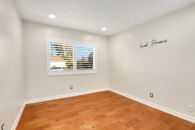 spare room featuring hardwood / wood-style floors