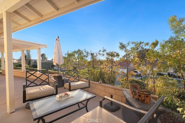 view of patio featuring outdoor lounge area and a pergola