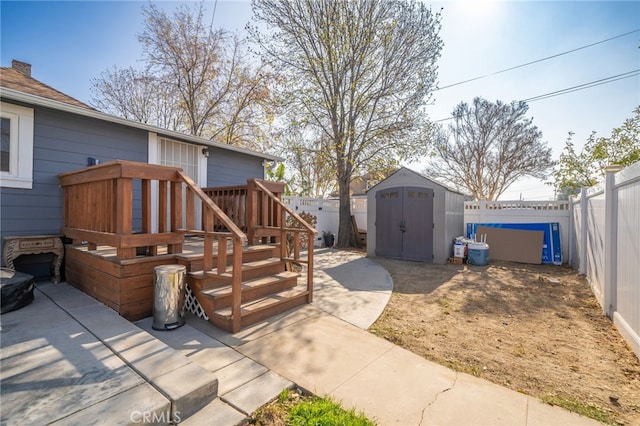 view of patio / terrace featuring a storage shed and a deck