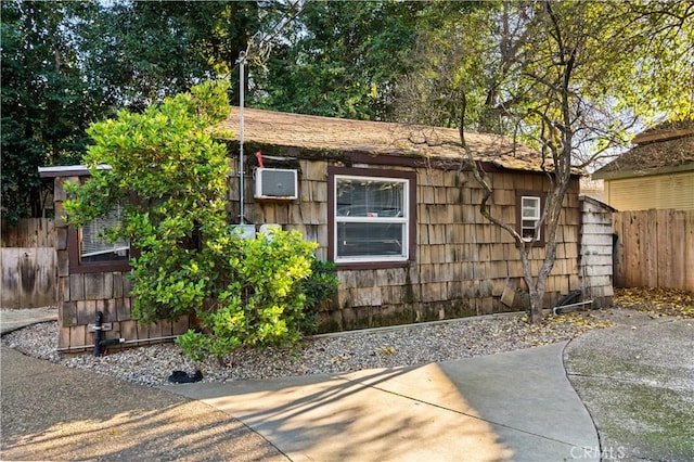 view of side of property with a patio area