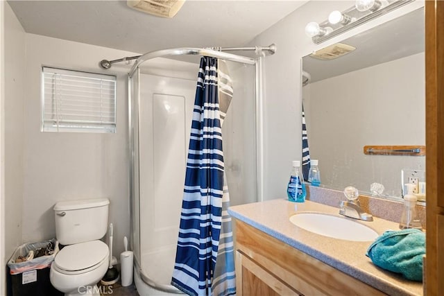 bathroom featuring toilet, a shower with curtain, and vanity