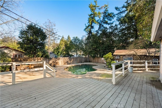 deck with a fenced in pool