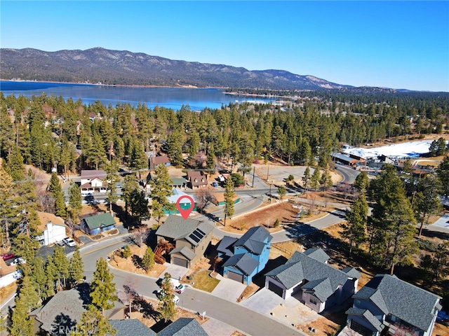 aerial view featuring a water and mountain view