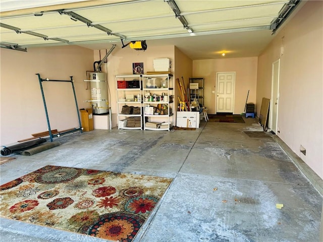 garage featuring a garage door opener and secured water heater