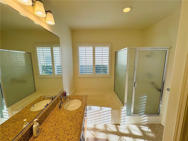 bathroom with vanity and separate shower and tub