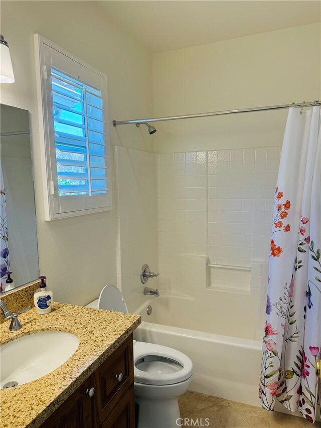 full bathroom featuring tile patterned flooring, vanity, shower / bath combination with curtain, and toilet