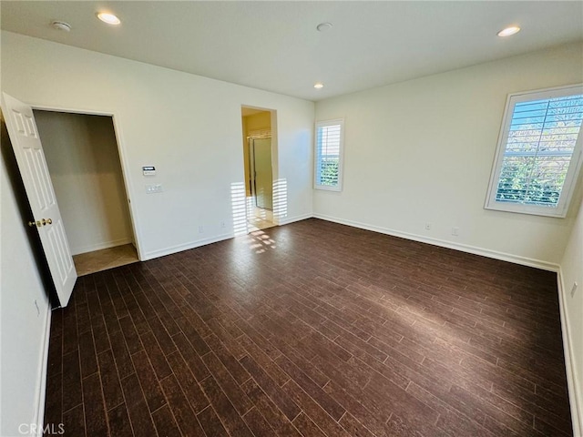 empty room featuring dark wood-type flooring