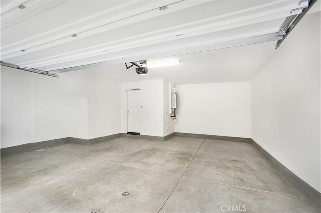 garage featuring a garage door opener and water heater