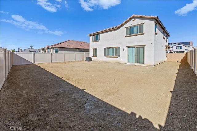 rear view of property with cooling unit