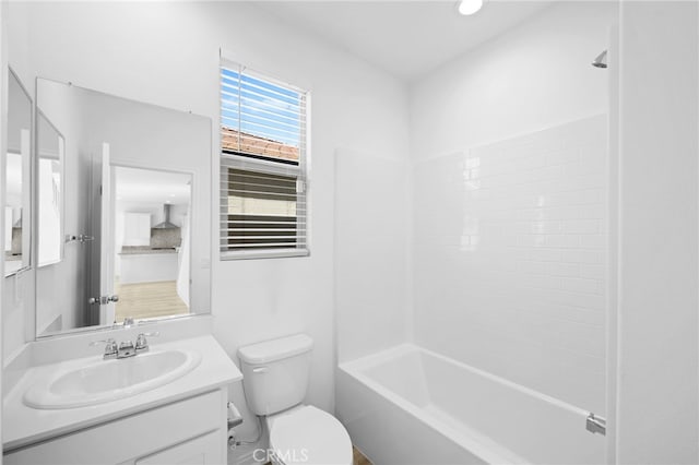 full bathroom featuring shower / tub combination, toilet, and vanity