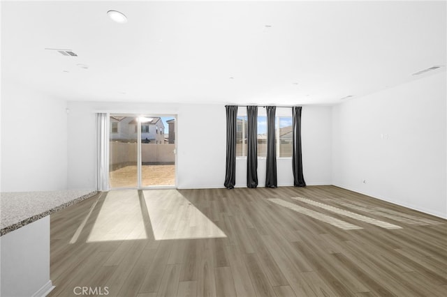 unfurnished living room with light hardwood / wood-style flooring