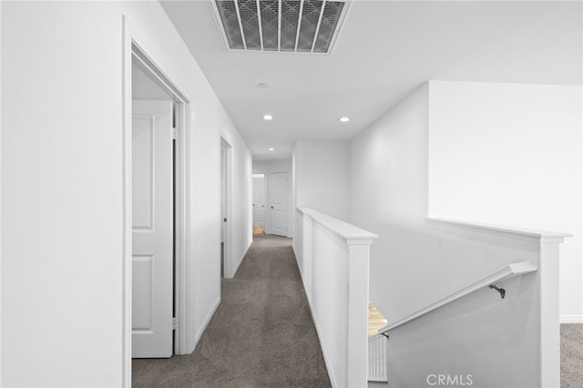 hallway featuring carpet, recessed lighting, visible vents, an upstairs landing, and baseboards