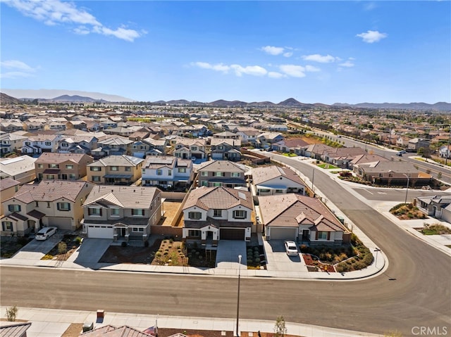 birds eye view of property with a residential view and a mountain view