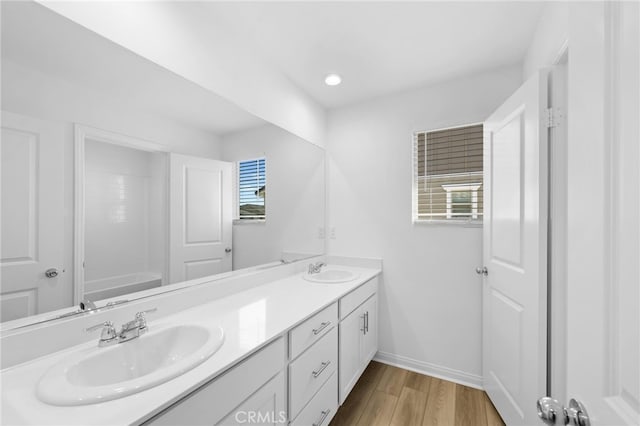 bathroom featuring vanity and wood-type flooring