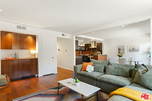 living room with dark hardwood / wood-style floors