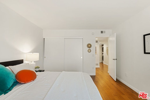 bedroom featuring a closet and wood-type flooring