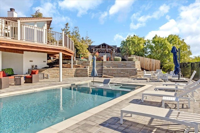 view of pool featuring a gazebo, a deck, and a patio area