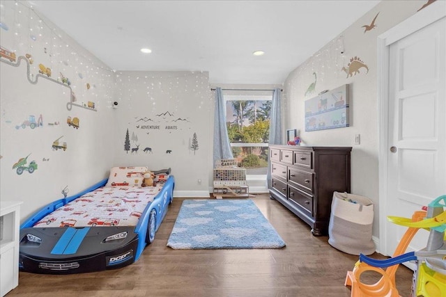 bedroom featuring dark hardwood / wood-style flooring