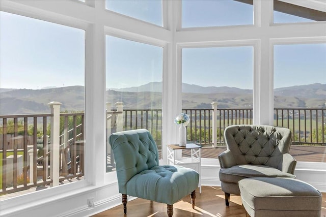 sunroom with a mountain view