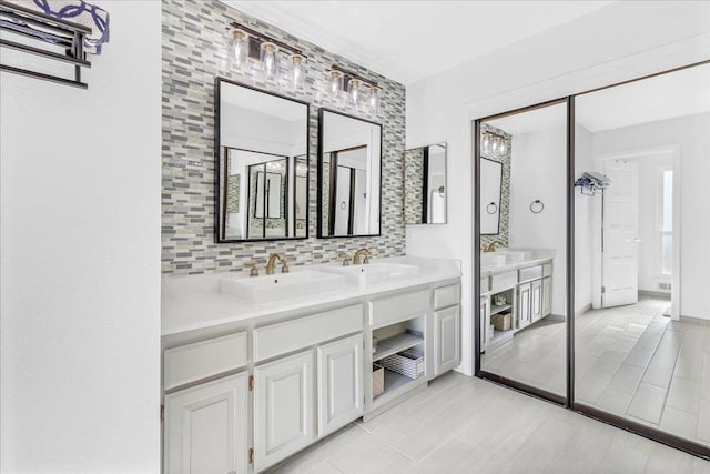 bathroom with vanity and decorative backsplash