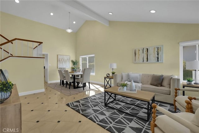 tiled living room with a healthy amount of sunlight and lofted ceiling with beams