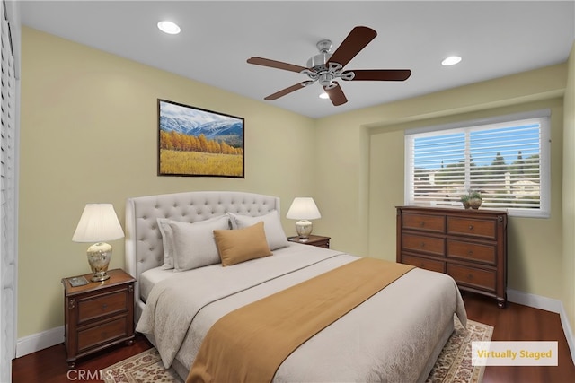 bedroom with ceiling fan and dark hardwood / wood-style floors