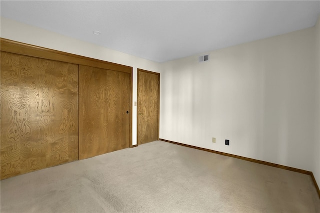 unfurnished bedroom featuring carpet flooring