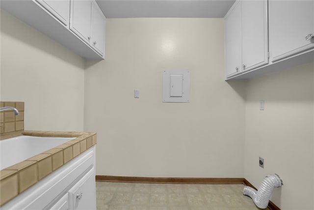 laundry room with cabinets, electric panel, sink, and electric dryer hookup