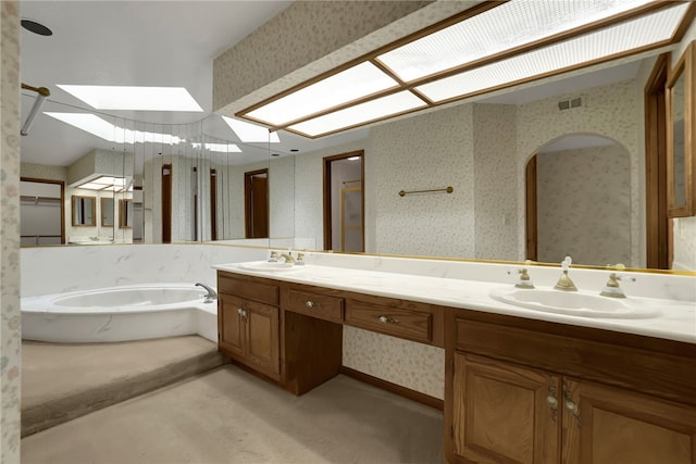 bathroom featuring vanity and a bathing tub