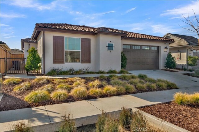 mediterranean / spanish-style house featuring a garage