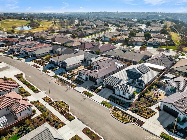 aerial view with a water view and a residential view