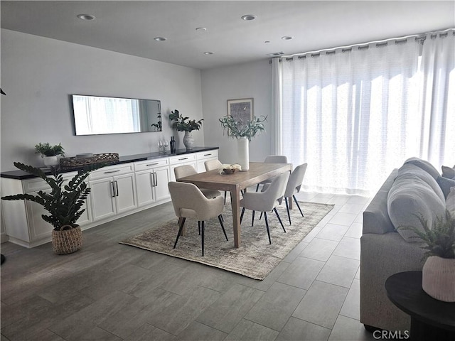 dining room featuring light wood-type flooring and recessed lighting