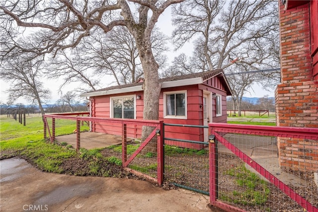 view of property exterior featuring a patio area