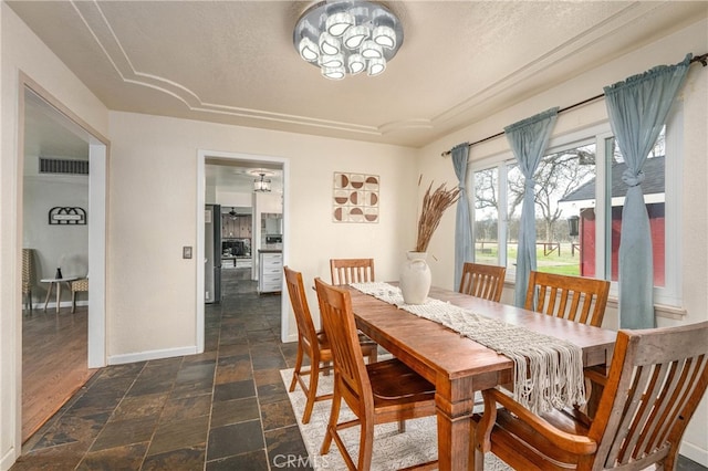 dining room featuring a textured ceiling