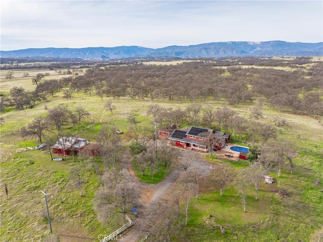 birds eye view of property featuring a rural view and a mountain view