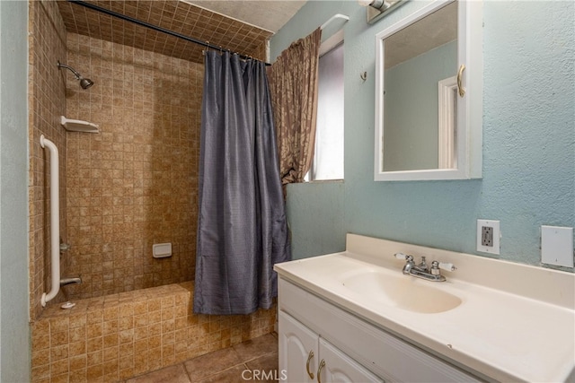 bathroom with tile patterned floors, vanity, and a shower with shower curtain