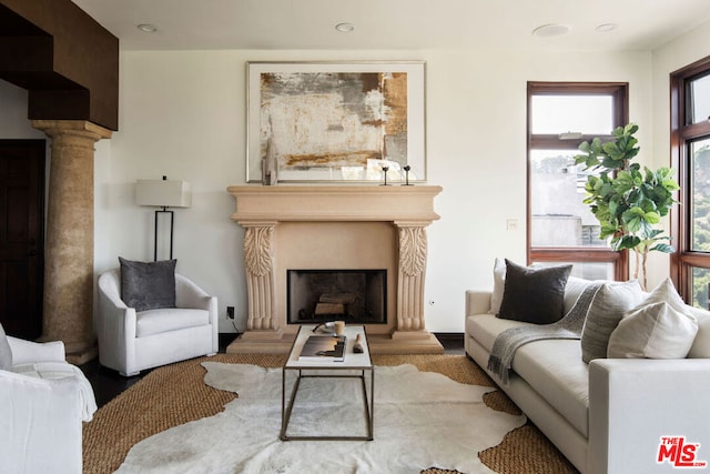 living room featuring decorative columns