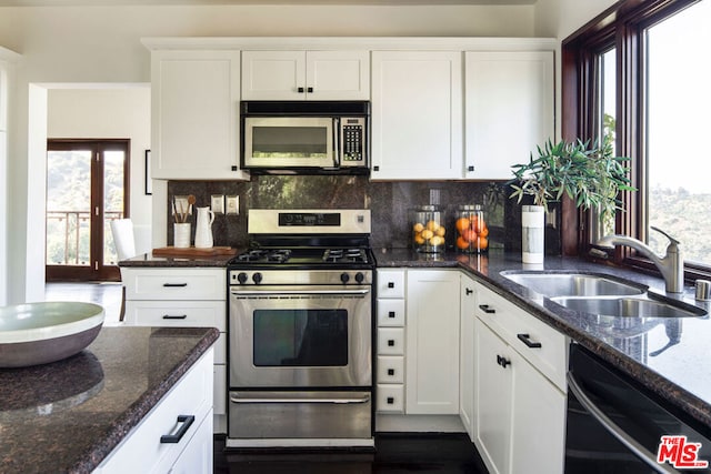 kitchen featuring sink, white cabinetry, and stainless steel appliances