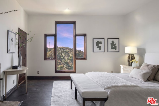 bedroom featuring dark hardwood / wood-style floors