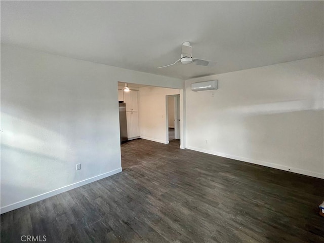 unfurnished room with dark wood-type flooring, ceiling fan, and a wall mounted AC