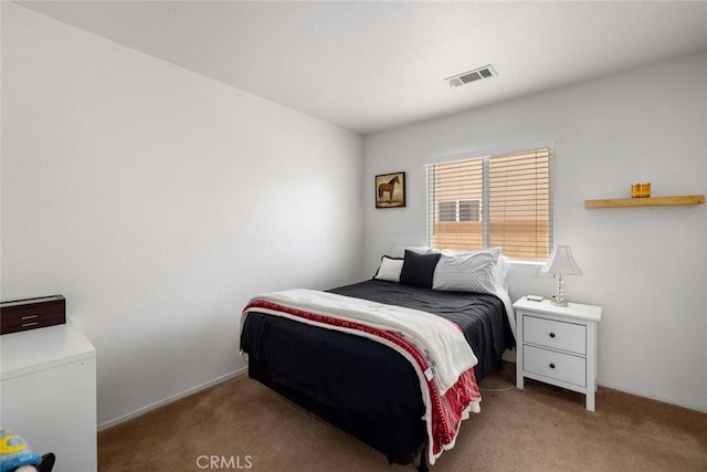 bedroom with light carpet