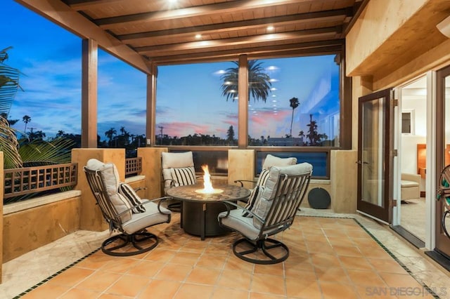 patio terrace at dusk with an outdoor fire pit