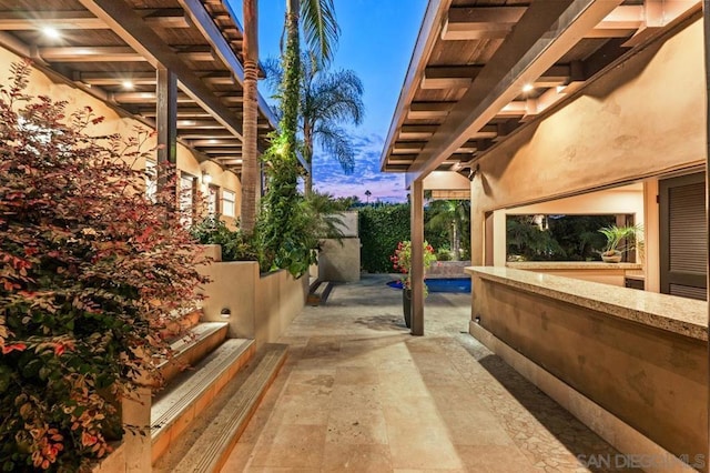 view of patio terrace at dusk