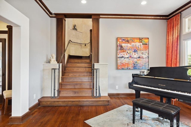 misc room with dark hardwood / wood-style floors and crown molding